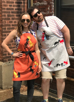 Dogs. Here To Remind You That Everything Is Exciting Funny Cooking and BBQ Apron Unisex 2 Pockets Adjustable Strap 100% Cotton | BlueQ at GetBullish