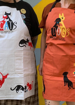 Dogs. Here To Remind You That Everything Is Exciting Funny Cooking and BBQ Apron Unisex 2 Pockets Adjustable Strap 100% Cotton | BlueQ at GetBullish