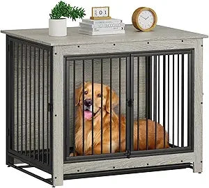 Dog inside a large metal crate with a wooden frame, sitting on a table.