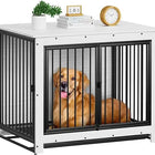 Dog in a black metal crate with a white top, surrounded by books and a plant on a white background